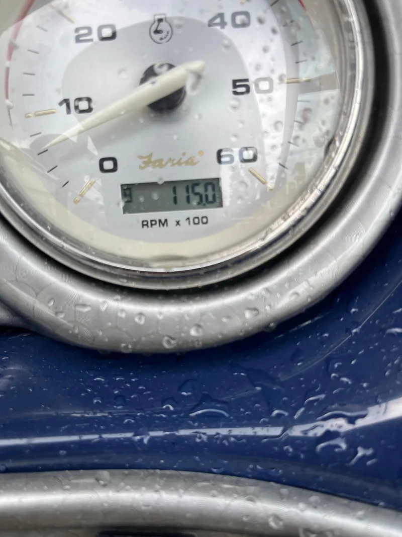 Slide: The Image of Close-up of a Rinker 276 Captiva Cuddy 2015 tachometer reading 1150 RPM. - 7