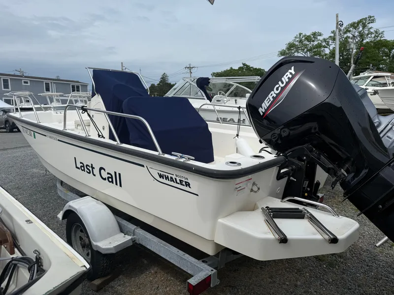 Slide: The Image of 2022 Boston Whaler 170 Montauk boat named "Last Call" with Mercury engine on trailer. - 4