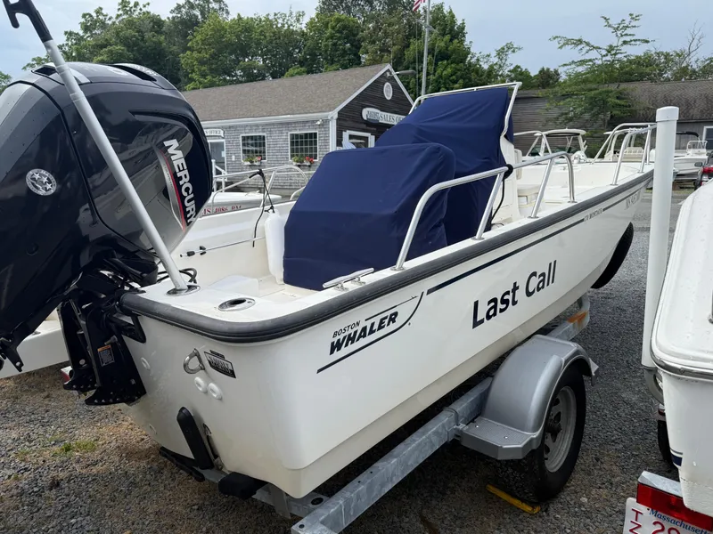 Slide: The Image of 2022 Boston Whaler 170 Montauk boat named "Last Call" on trailer with Mercury engine. - 5