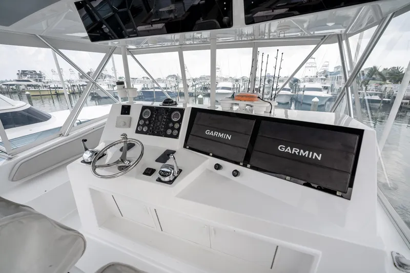 Slide: The Image of Interior of 1995 Viking 50 yacht with Garmin navigation displays and steering wheel. - 14