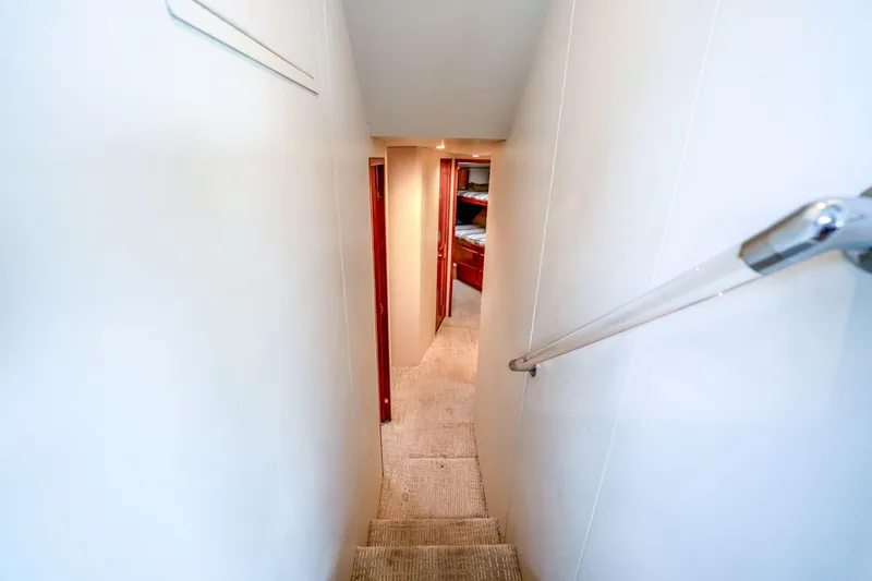 Slide: The Image of Narrow hallway inside 1995 Viking 50 yacht, leading to cozy cabin area. - 29