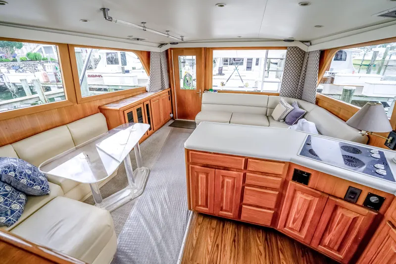 Slide: The Image of Luxurious interior of a 1995 Viking 50 yacht with elegant seating and modern amenities. - 30