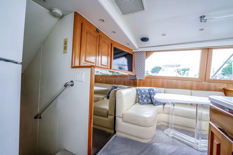 Slide: The Image of Luxurious interior of a 1995 Viking 50 yacht with plush seating and elegant decor. - 34