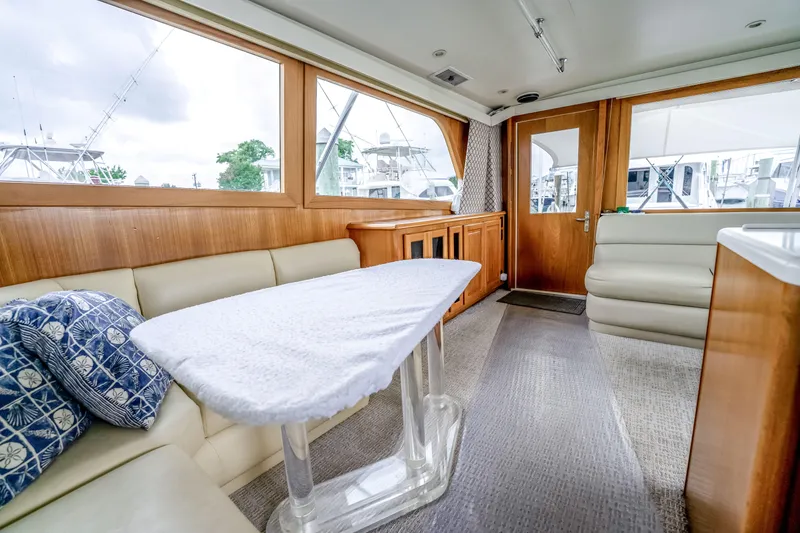 Slide: The Image of Luxurious interior of a 1995 Viking 50 yacht with plush seating and elegant wood finishes. - 35
