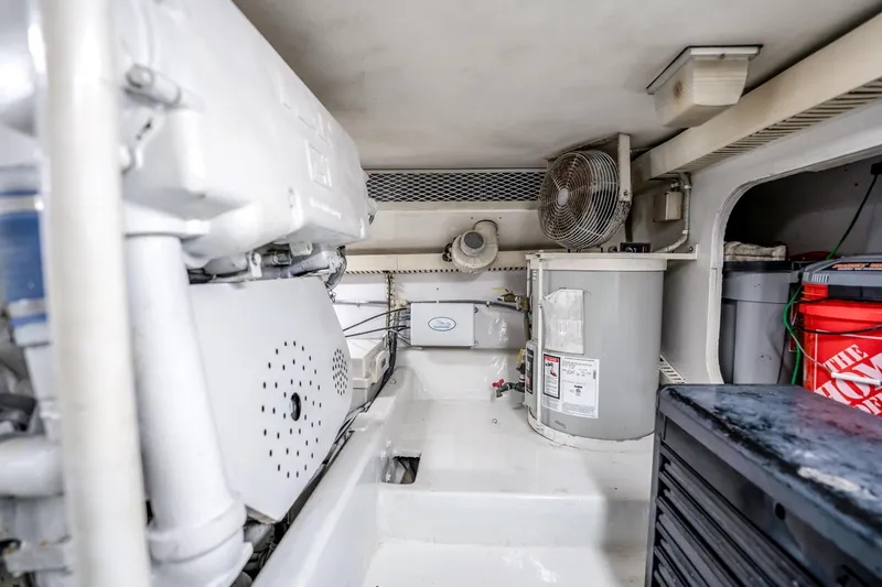 Slide: The Image of Engine room of a 1995 Viking 50 yacht with equipment and storage. - 41