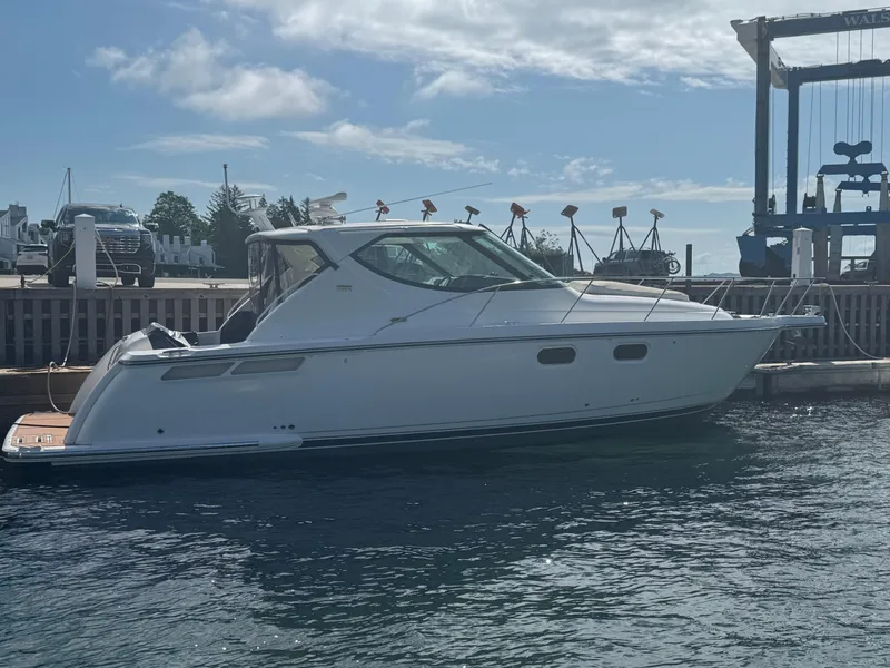 Slide: The Image of 2011 Tiara Yachts 3900 Sovran docked at marina under clear sky. - 1