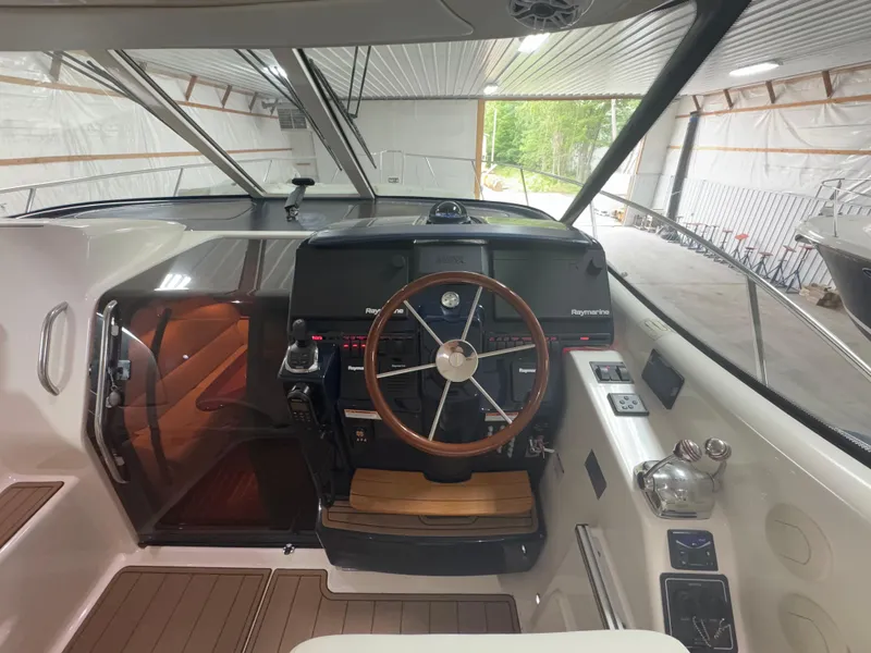 Slide: The Image of 2011 Tiara Yachts 3900 Sovran helm with Raymarine electronics and wooden steering wheel. - 13