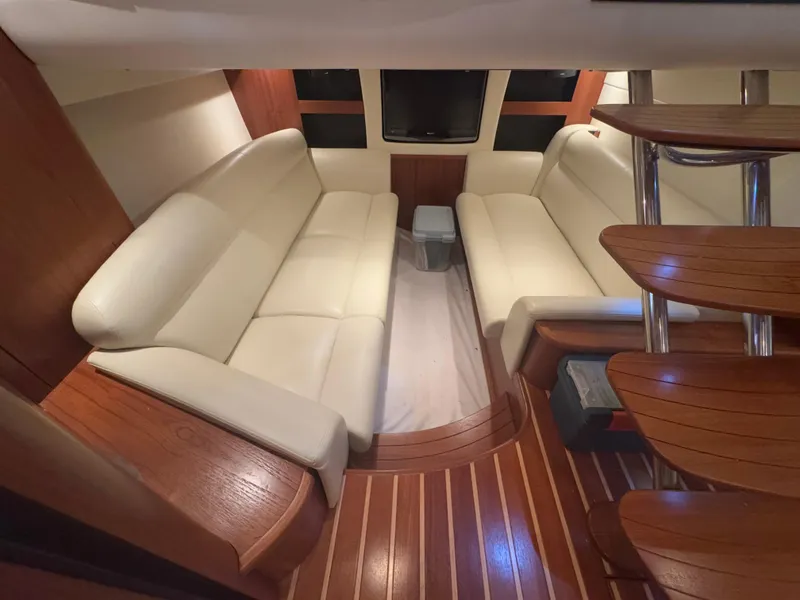 Slide: The Image of Luxurious interior of 2011 Tiara Yachts 3900 Sovran with cream leather seating and wooden flooring. - 15