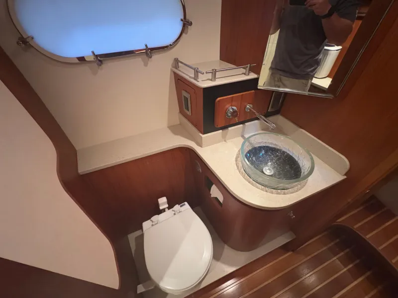 Slide: The Image of Luxurious bathroom in 2011 Tiara Yachts 3900 Sovran with modern fixtures and wooden accents. - 16