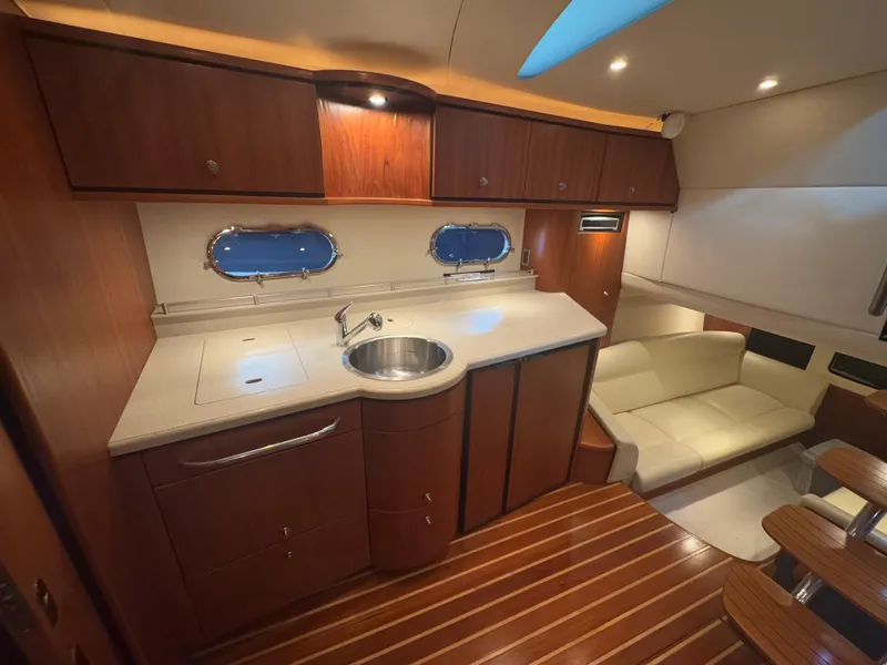 Slide: The Image of Luxurious interior of 2011 Tiara Yachts 3900 Sovran with modern kitchen and seating area. - 17