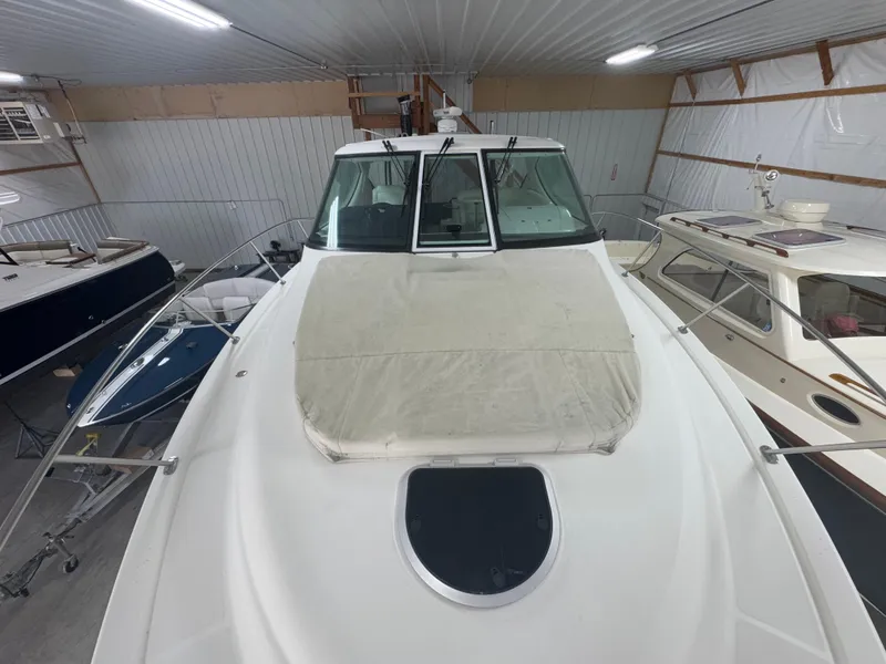 Slide: The Image of 2011 Tiara Yachts 3900 Sovran in storage, showcasing sleek design and spacious deck. - 19