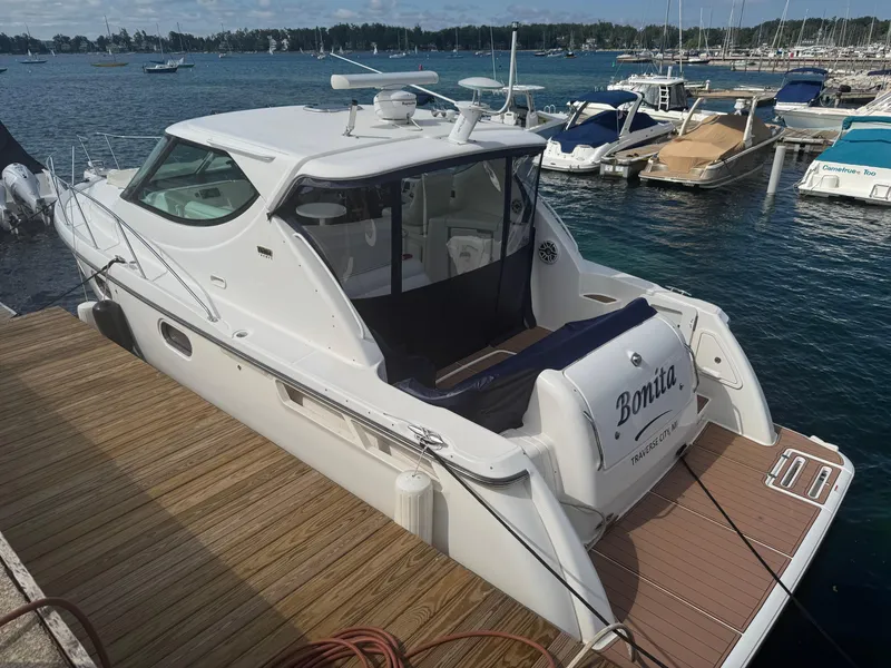 Slide: The Image of 2011 Tiara Yachts 3900 Sovran docked at marina, rear view. - 2