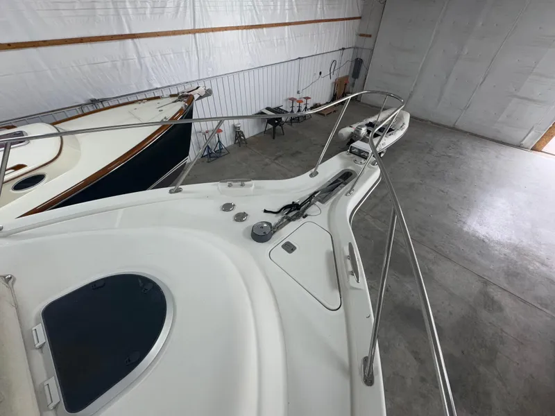 Slide: The Image of 2011 Tiara Yachts 3900 Sovran in storage, showcasing sleek deck and railing design. - 20