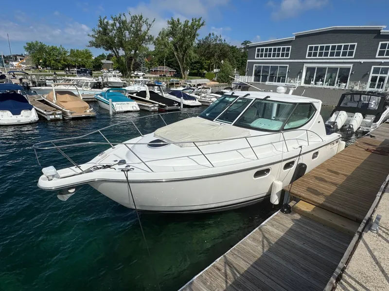 Slide: The Image of 2011 Tiara Yachts 3900 Sovran docked at a marina with other boats. - 4