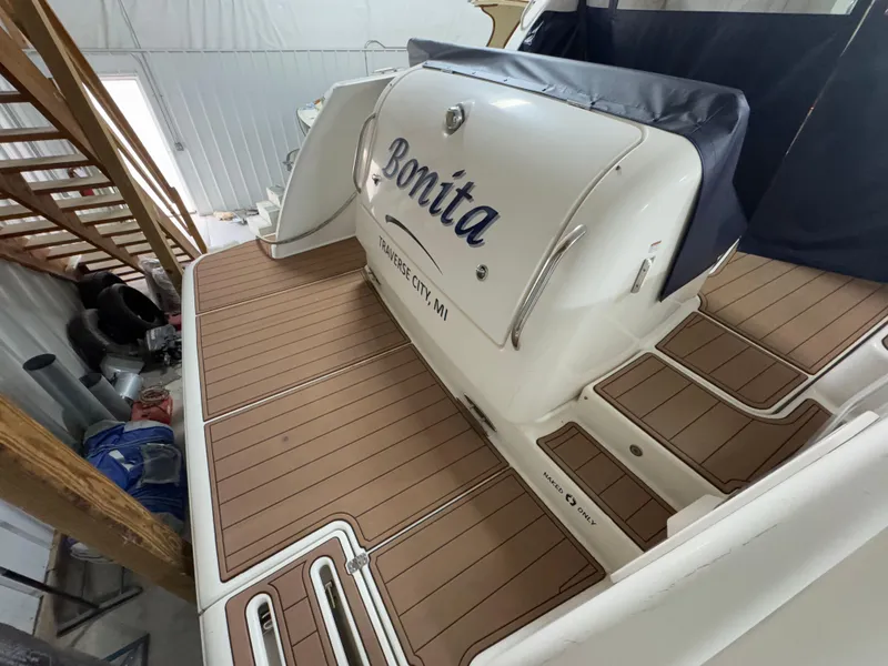 Slide: The Image of 2011 Tiara Yachts 3900 Sovran docked, featuring teak deck and Traverse City, MI marking. - 9