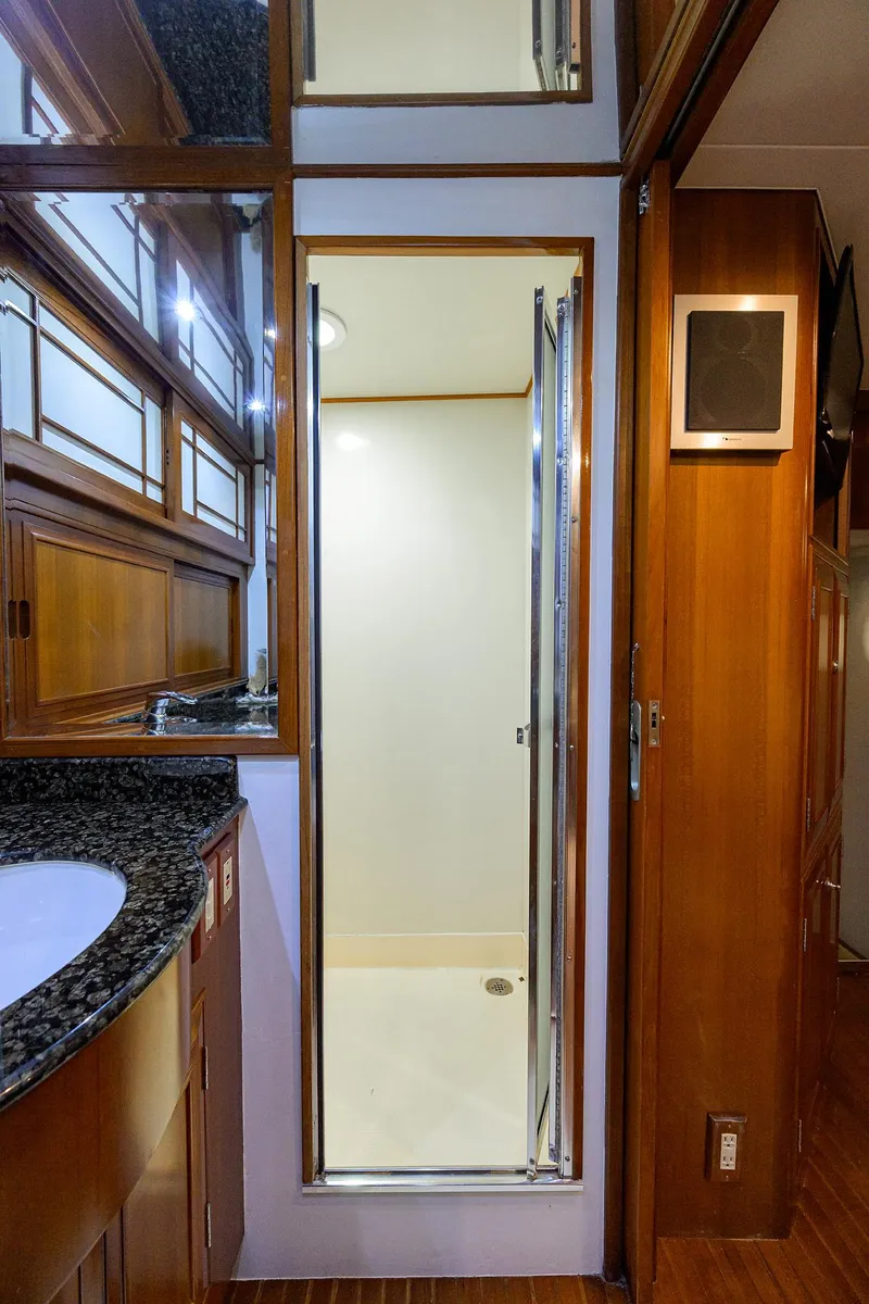 Slide: The Image of Luxurious bathroom interior of 2001 Ocean Alexander 602 yacht with granite countertop and shower. - 13