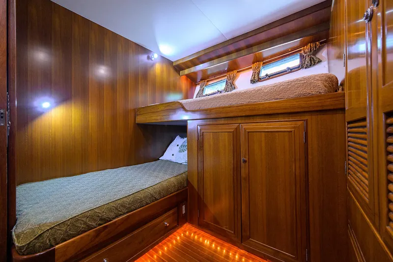 Slide: The Image of Luxurious wooden cabin interior of 2001 Ocean Alexander 602 yacht with cozy bunk beds. - 19