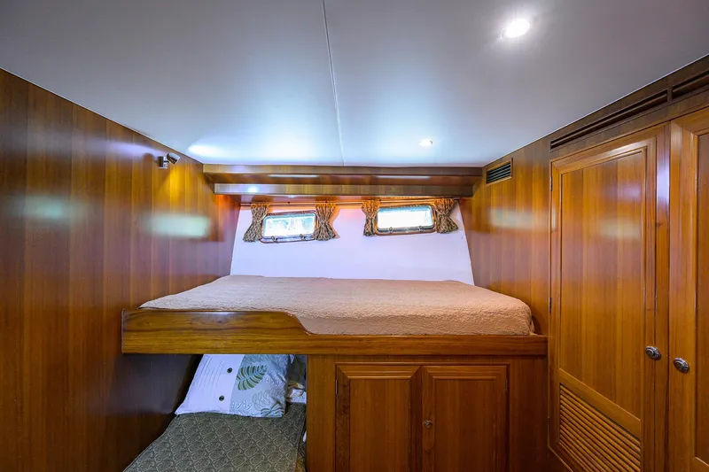 Slide: The Image of Luxurious wooden cabin interior of 2001 Ocean Alexander 602 yacht with cozy bedding. - 20