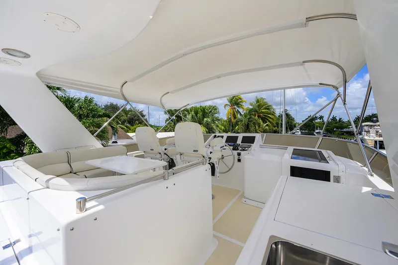 Slide: The Image of Luxurious 2001 Ocean Alexander 602 yacht cockpit with seating and navigation controls. - 28