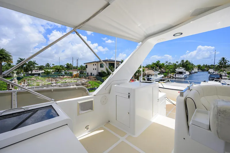 Slide: The Image of Luxurious Ocean Alexander 602 yacht deck, 2001 model, with marina view and clear blue sky. - 33