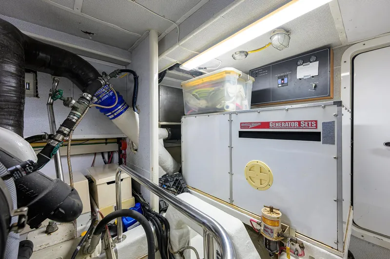 Slide: The Image of Engine room of 2001 Ocean Alexander 602 yacht with generator and equipment. - 48