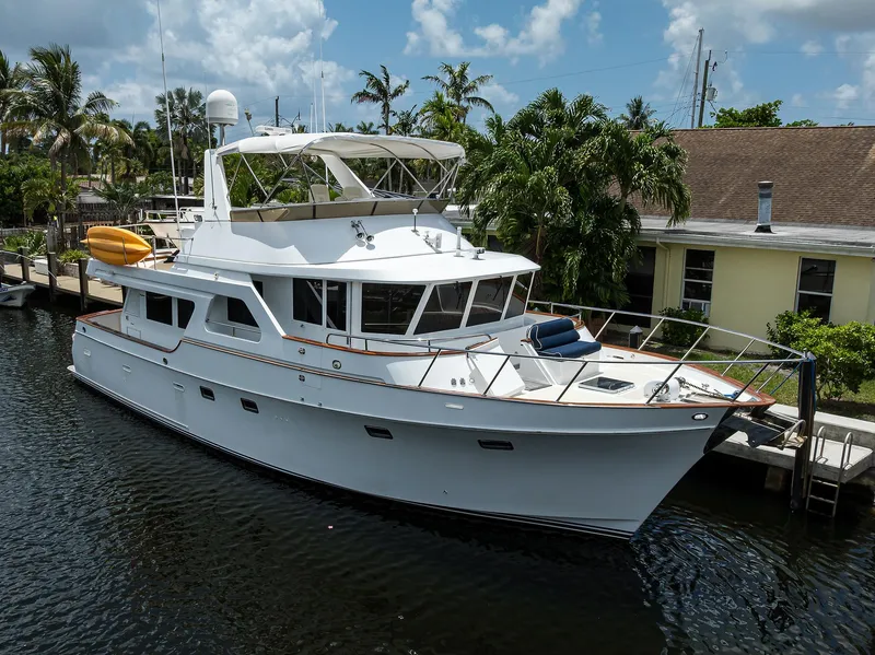 Slide: The Image of 2001 Ocean Alexander 602 yacht docked by tropical waterfront home. - 49