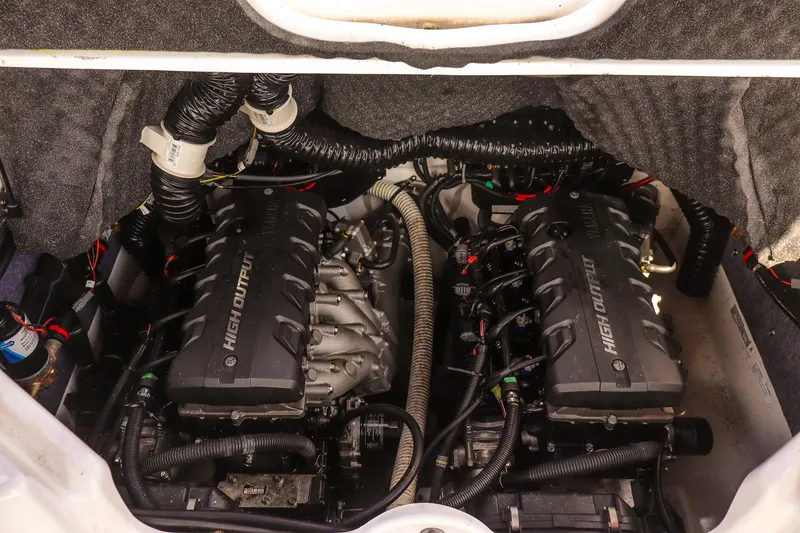 Slide: The Image of 2019 Yamaha Boats 242X E-Series engine compartment with dual high-output engines. - 19