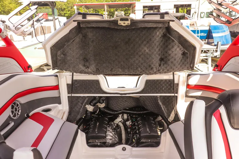 Slide: The Image of 2019 Yamaha Boats 242X E-Series engine compartment with open hatch, showcasing interior details. - 20