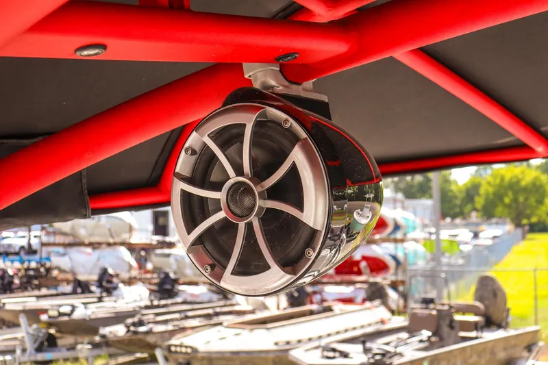 Slide: The Image of Speaker on 2019 Yamaha Boats 242X E-Series, red frame, outdoor setting. - 21