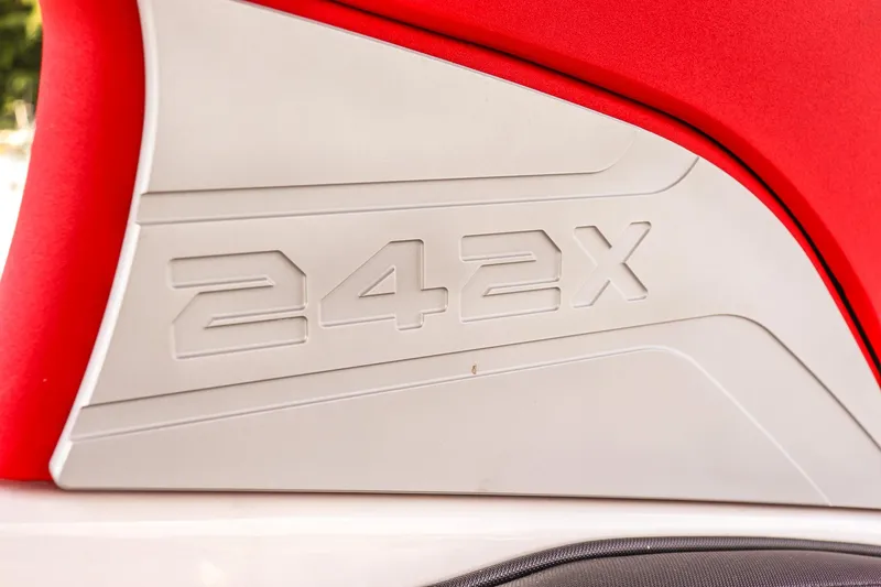 Slide: The Image of 2019 Yamaha Boats 242X E-Series logo on red and white boat panel. - 27