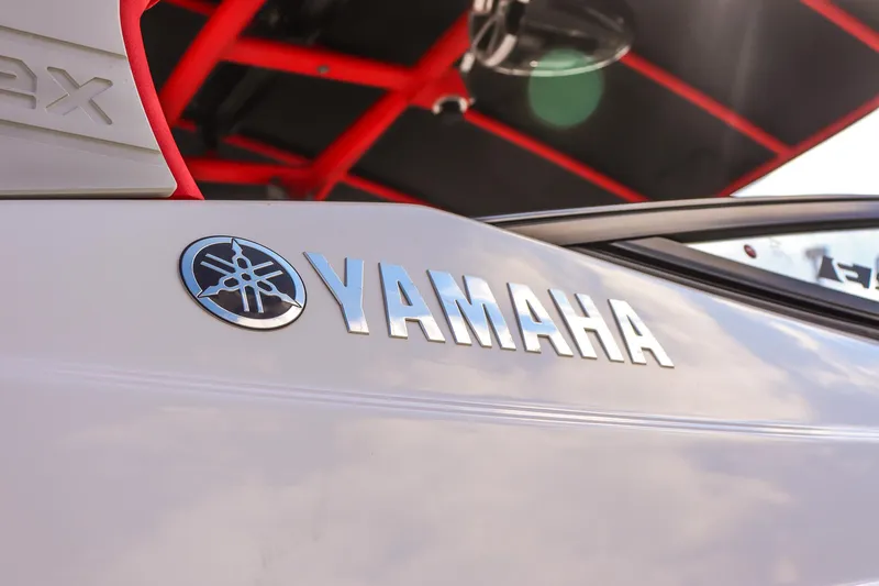 Slide: The Image of 2019 Yamaha Boats 242X E-Series logo on sleek white surface with red accents. - 29