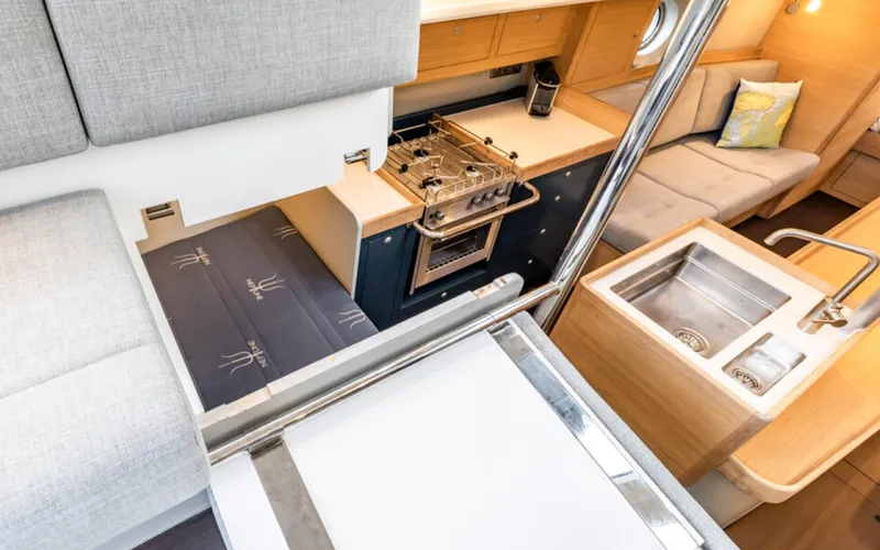 Slide: The Image of Interior of 2026 Bestevaer 42 S/Y yacht, featuring modern kitchen and seating area. - 42