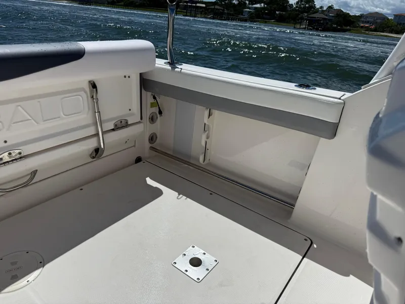 Slide: The Image of 2021 Robalo R247 boat interior with seating and ocean view. - 15