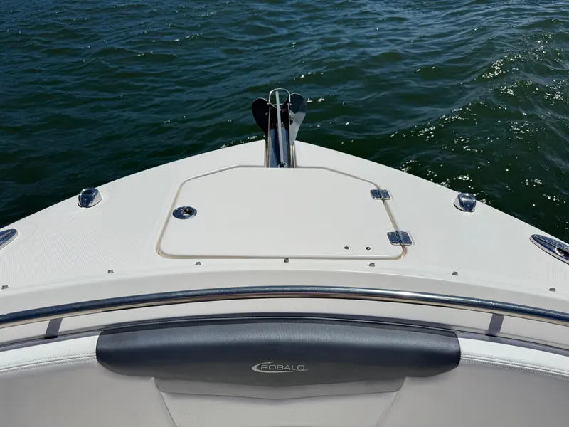 Slide: The Image of 2021 Robalo R247 boat bow with anchor, on calm water. - 18