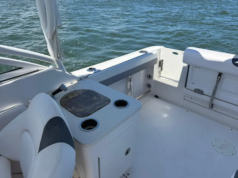 Slide: The Image of 2021 Robalo R247 boat interior with seating and water view. - 21