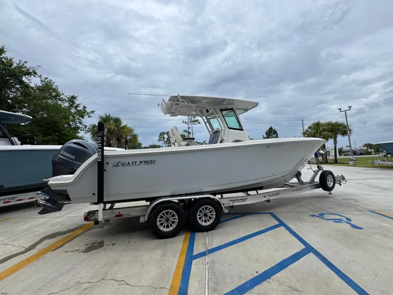 Slide: The Image of 2022 Sailfish 272 CC boat on trailer in parking lot, overcast sky. - 10