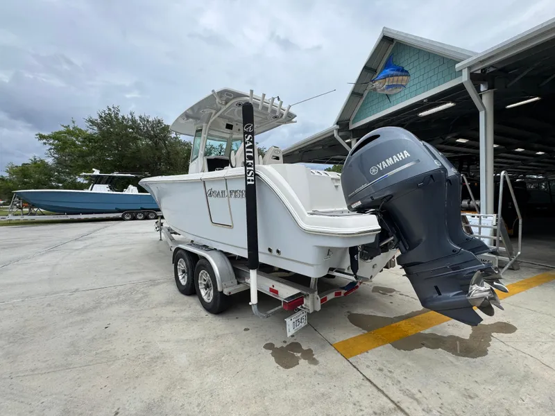 Slide: The Image of 2022 Sailfish 272 CC boat with Yamaha engine on a trailer at a marina. - 15