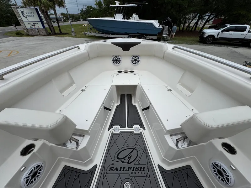 Slide: The Image of Interior view of 2022 Sailfish 272 CC boat, featuring spacious seating and modern design. - 18