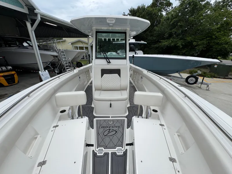 Slide: The Image of 2022 Sailfish 272 CC boat interior with seating and storage compartments. - 22