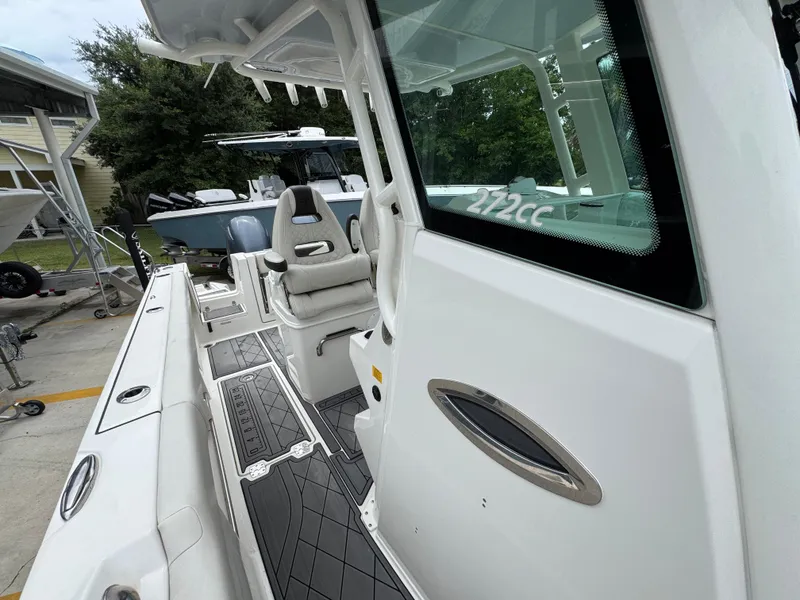 Slide: The Image of 2022 Sailfish 272 CC boat interior with seating and deck details. - 24