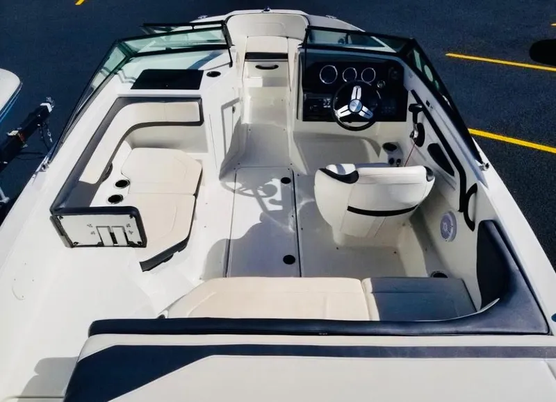 Slide: The Image of 2018 Sea Ray SPX 190 boat interior with seating and steering wheel. - 11