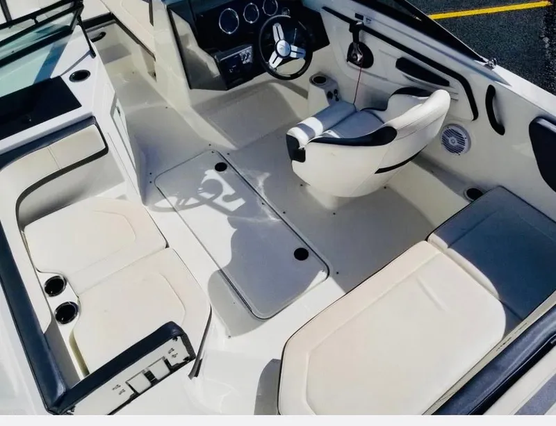 Slide: The Image of 2018 Sea Ray SPX 190 boat interior with steering wheel and seating. - 12
