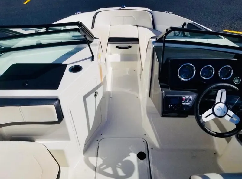 Slide: The Image of 2018 Sea Ray SPX 190 boat interior with steering wheel and dashboard. - 13