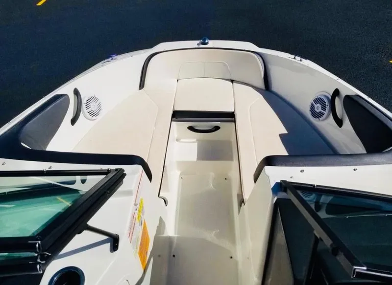 Slide: The Image of 2018 Sea Ray SPX 190 boat interior with seating and speakers. - 14
