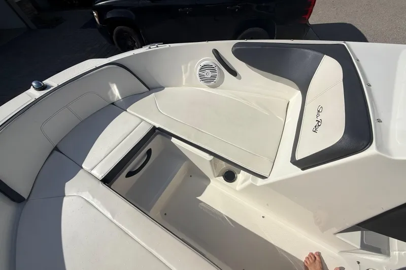 Slide: The Image of 2018 Sea Ray SPX 190 boat interior with seating and speaker, showcasing luxury design. - 22