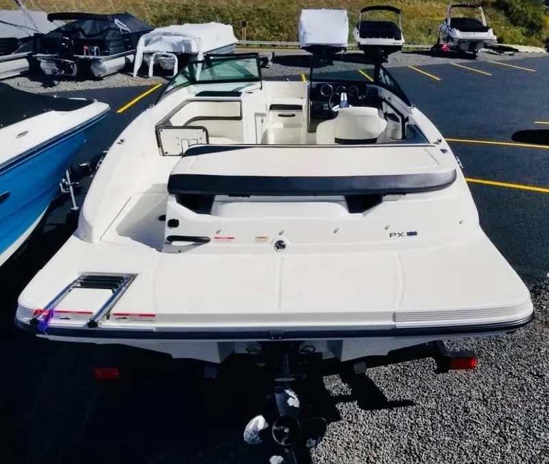 Slide: The Image of 2018 Sea Ray SPX 190 boat parked in a lot, rear view. - 6