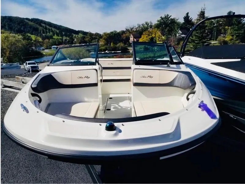 Slide: The Image of 2018 Sea Ray SPX 190 boat with open bow seating, parked outdoors. - 7