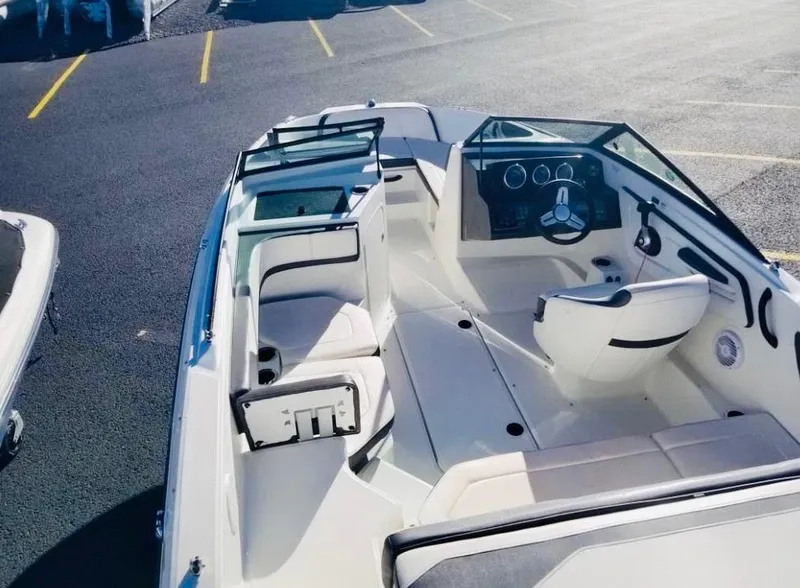 Slide: The Image of 2018 Sea Ray SPX 190 boat interior with seating and steering wheel. - 8