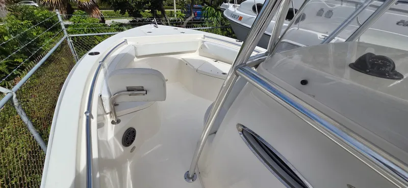 Slide: The Image of 2023 Cobia 220 Center Console boat interior with seating and railing. - 15