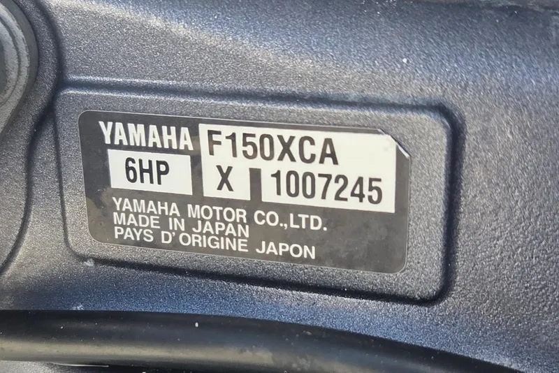Slide: The Image of Yamaha F150XCA engine label on 2023 Cobia 220 Center Console boat. - 18